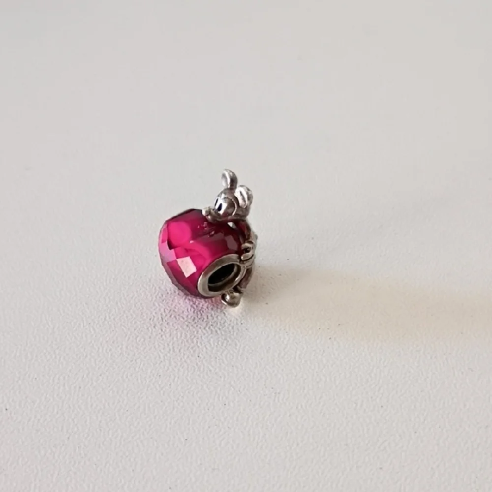 Pandora Disney Mickey Mouse Heart charm featuring a fuchsia crystal.